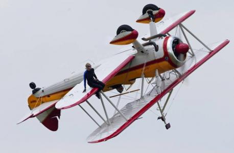 Wing walker Jane Wicker was a very famous performer who used to challenge gravity before her tragic death, during a live act, in 2013. Wicker's last walk followed a loop, so that Wicker was sitting on the wing of the upside down plane. No one knows exactly why the wing banked sharply to the ground, but it did, and Jane died just moments after this picture was taken. Have you heard about this story?