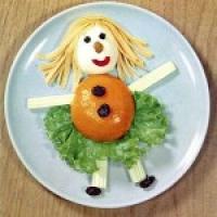 Or perhaps a Raggedy Ann Salad? ( A hard-boiled egg head and a peach-half body.)