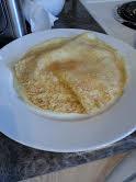 The food on the picture is known as blinchikis or crapes in English. They are very good hot on their own, with sour cream, whip cream and fruits and other fillings. Have you ever tried blinchikis?