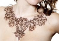 In Victorian times, art and jewelry made from human hair was quite popular and elaborate. In modern times, however, the idea of artwork created from hair has fallen out of favour. Part of the reason is that people often have an aversion to hair that is no longer growing on their head. This very aversion, however, inspired a 23 year old art student from Cambridge, England to try creating artwork using hair to see if she could create something that people would find attractive enough to overcome the aversion. Spending days using broken saw blades to cut and weave strands of hair into abstract shapes, Kerry Howley ended up creating five 