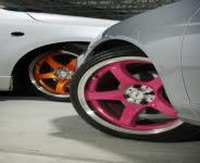 Here's a picture of a car with the candy cotton rims on (the one in front, behind is the orange/tangerine). Do you think candy cotton is too feminine for a man to put on his car?